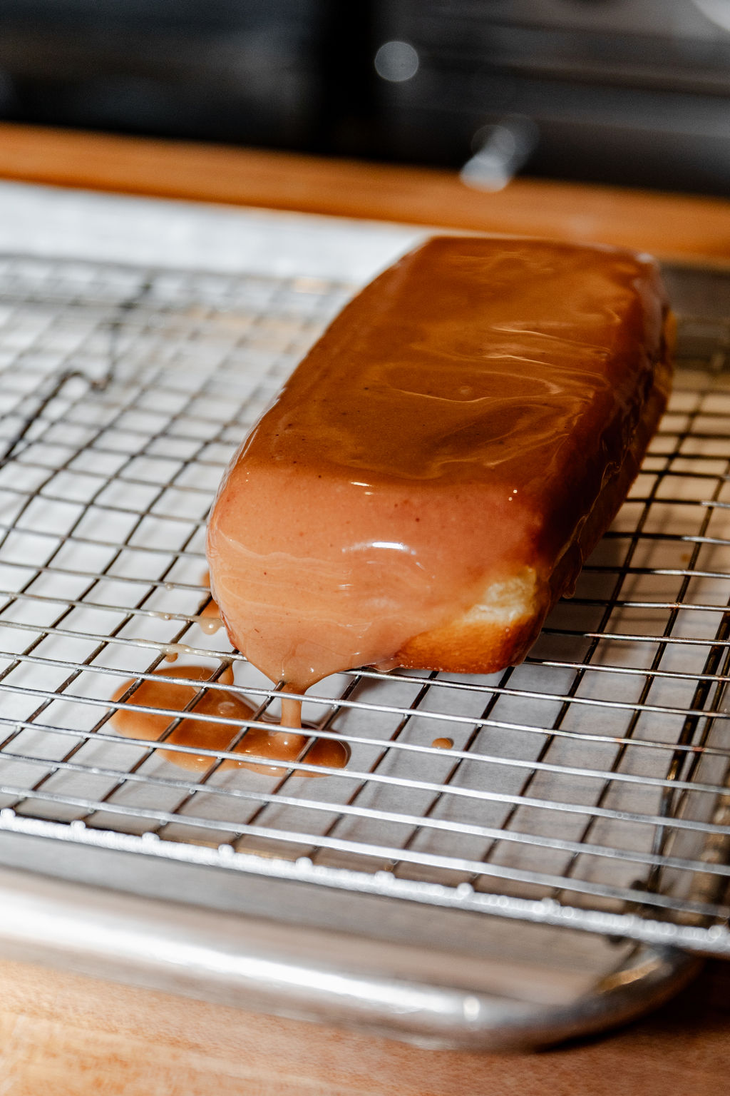 Glazed pastry bar cooling on a rack